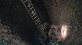 Police officials rescue man fallen down abandoned well in southern India