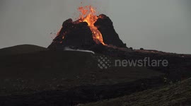 People under active erupting Geldingadalir volcano, Iceland March 2021