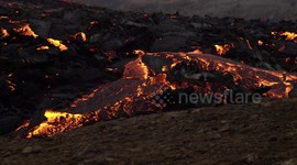 Geldingadalir volcano eruption magma burning grass Iceland March 2021