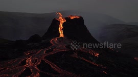 Geldingadalir volcano erupts glowing magma at dusk,  Iceland March 2021