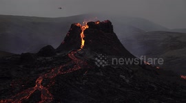 Helicopter flies over Geldingadalir volcano eruption, Iceland March 2021