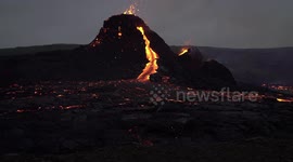 Magma river flows from Geldingadalir volcano cone, Iceland March 2021