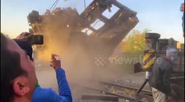 Crane removes train wreckage after deadly collision in Egypt