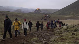 Visitors walking towards Geldingadalir volcano, Fagradalsfjall Iceland March 2021