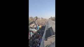 Eyewitness films video from on top of crashed Egypt train as locals gather around wreckage