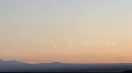 Space X Falcon 9 rocket renters orbit at sunrise over Hawaii