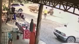 Chaos as Thai farmer tries to chase runaway tractor before it causes a smash