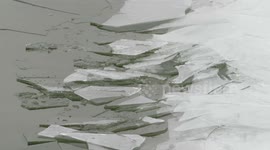 Intense cracking noise as shards of ice stack on Lake Superior shore in Wisconsin, US