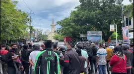 Locals gather at scene of suspected suicide attack outside Catholic church in Indonesia