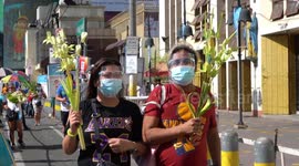 Filipinos go to church on Palm Sunday despite imminent religious gathering ban