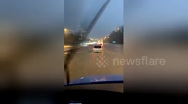 Truck drives through flash floods on Interstate 24 in Nashville