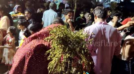 The women's gather around a bonfire and pray and perform Holika Dahan rituals