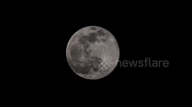 ANIMATION OF FULL MOON WORM SUPERMOON RISING IN SWITZERLAND