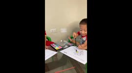 Extraordinary special child paints with many colors together with his brother mike