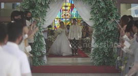 Wedding fail: Newlyweds try to perform back-bending kiss but fall over