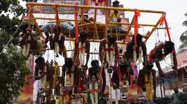 Hindu devotees endure skin-stretching pain after hanging from body-piercing hooks during annual ritual