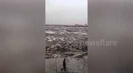 Bridge collapses after succumbing to river of ice in northern China