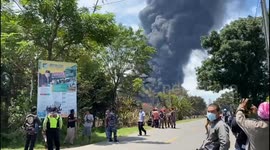 Firefighters seen speeding towards Indonesia oil refinery blaze