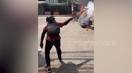 Myanmar protesters fire flares and hurl molotov cocktails during clashes with soldiers