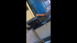 'Funny Clip of Two Men Struggling to Carry a Partially-Filled Fish Tank'