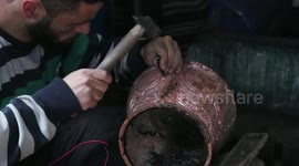 Satisfying video shows skilled coppersmith making engraved pots in north India
