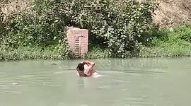 Police officer jumps into canal to save drowning man in northern India