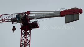 Black Lives Matter protestor unfurled a new banner on crane in Canning Town
