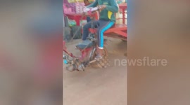 Farmer uses amusing modified motorcycle to pull trailer in Cambodia