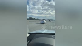 Car drives along highway on the wheel rims after losing tire in California