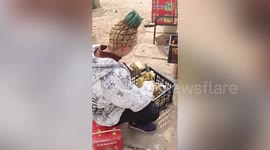 Chinese fruit vendor gets pineapple haircut to attract more customers
