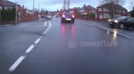 UK cyclist left with sprained back after being knocked over by oncoming car