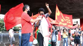 Demonstration in Sao Paolo with flags and banners in repudiation of the 1964 military coup in Brazil