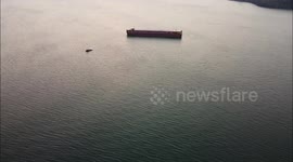 Popular beach closed in Wales to allow huge barge to deliver a Nuclear generator (Aerial footage of the ship)