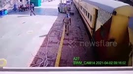 Security personnel saves passenger from sliding under train in northern India