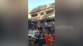 Building collapses after a fire killing five people in Bangkok, Thailand