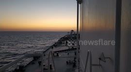 Sailing towards the twilight with a giant beast.