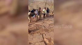 Police personnel tend to ailing man in southern India