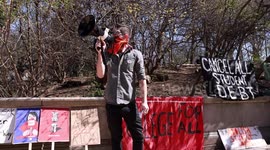 Protestors symbolically burn their “student debt” at Brooklyn rally to cancel college loan obligations