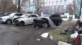 Blue Audi of Edward Bil that rammed black Volkswagen of Maria Artemova among damaged cars outside the Head Department of Internal Affairs for Moscow CAO