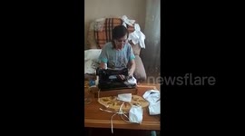 Grandmother from Naberezhnye Chelny, Russia sews handmade face masks for neighbors