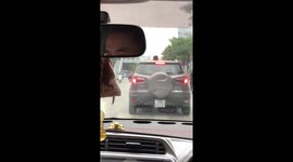 What do you see on the roof of this car? Is it a human head?