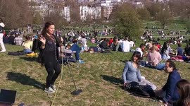 Musician serenades Primrose Hill Sun Bathers in North London