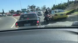 Road rage: incensed Australian biker smashes driver's wing mirror