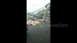 Lightning strike downs roof as heavy rains batter Yogyakarta in Indonesia