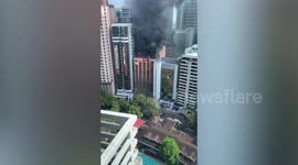 Fire rips through office block in business district of the Philippines