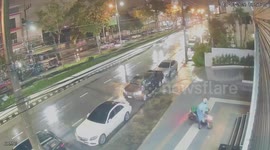 Food delivery rider skids motorcycle on wet pavement to park like a pro
