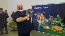 Hype at Bitaps stand with free T-shirts giveaway by sponsors of Blockchain and Bitcoin Conference 2021 in Moscow