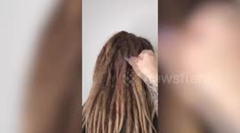 This astonishing transformation shows the moment a Russian hairdresser completely transforms a dreadlocked model and gives her a fresh new look.