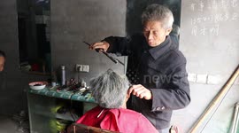 Chinese hairdresser uses red-hot tongs to curl hair for customers