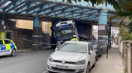 Large truck gets stuck under a bridge in Camden, north London